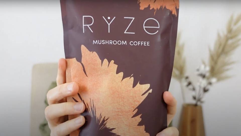 Ryze mushroom coffee powder being prepared in hot water