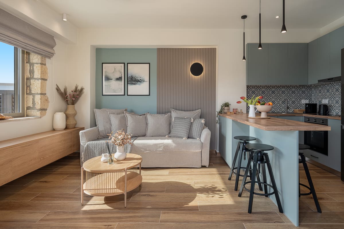 Modern open-plan living room and kitchen with stylish decor.