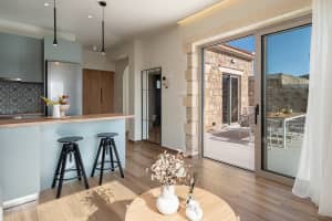 Modern open-plan living room and kitchen with stylish decor.