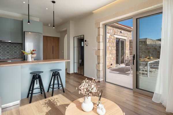 Modern open-plan living room and kitchen with stylish decor.