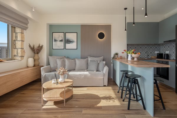 Modern open-plan living room and kitchen with stylish decor.