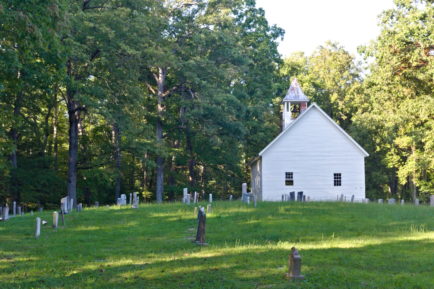 The historic Cades Cove Primitive Baptist Church, surrounded by its graveyard.