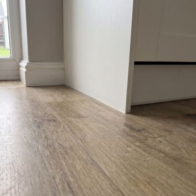 The same kitchen floor and skirting after cleaning