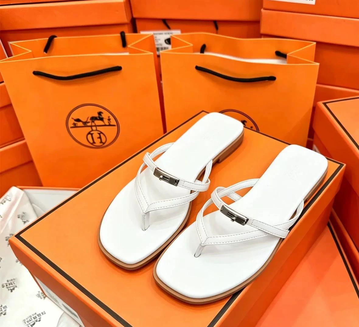Flat flip flops with metal buckle thumbnail