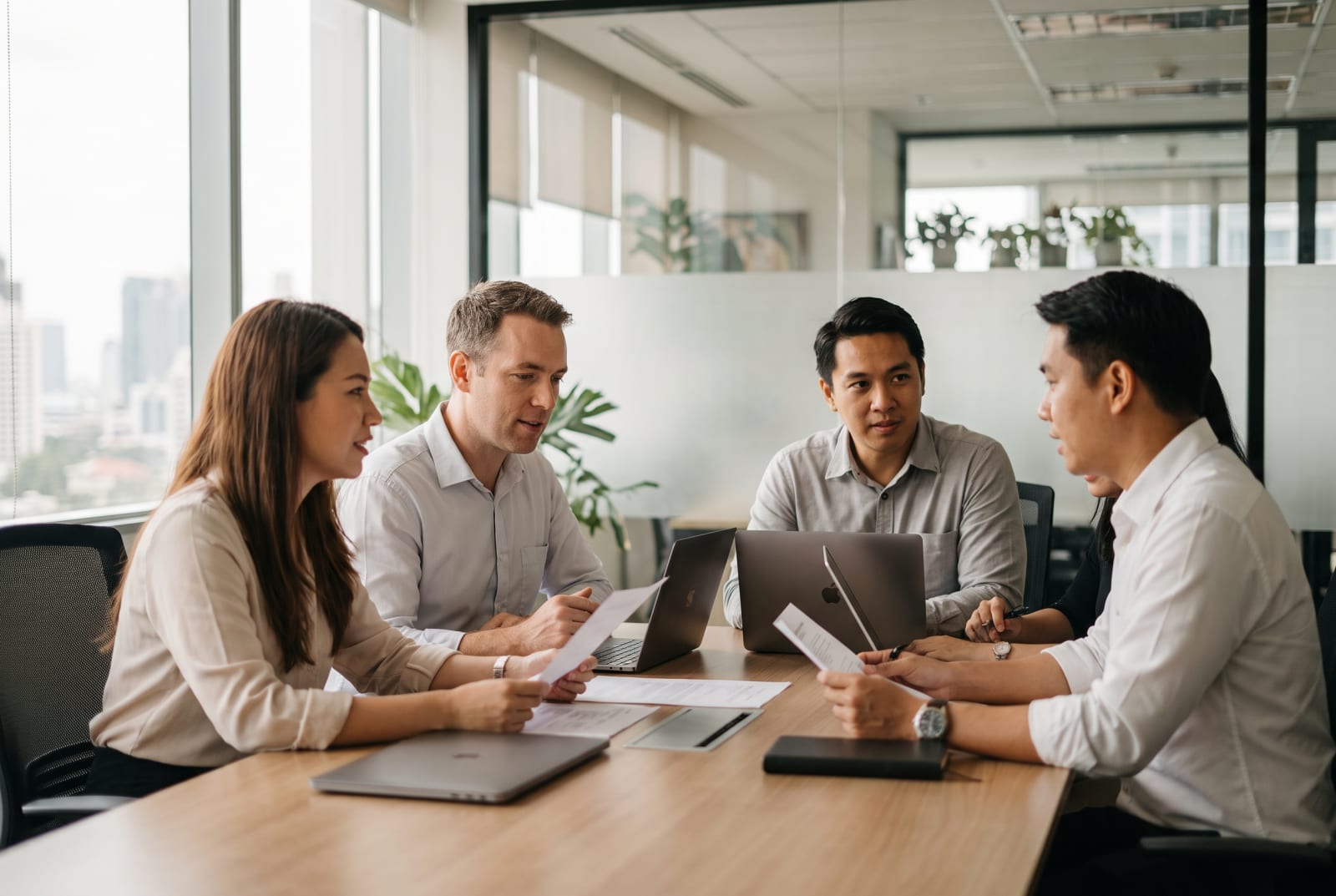 Team or office photo — the people behind Visa Centre, or a Bangkok workspace