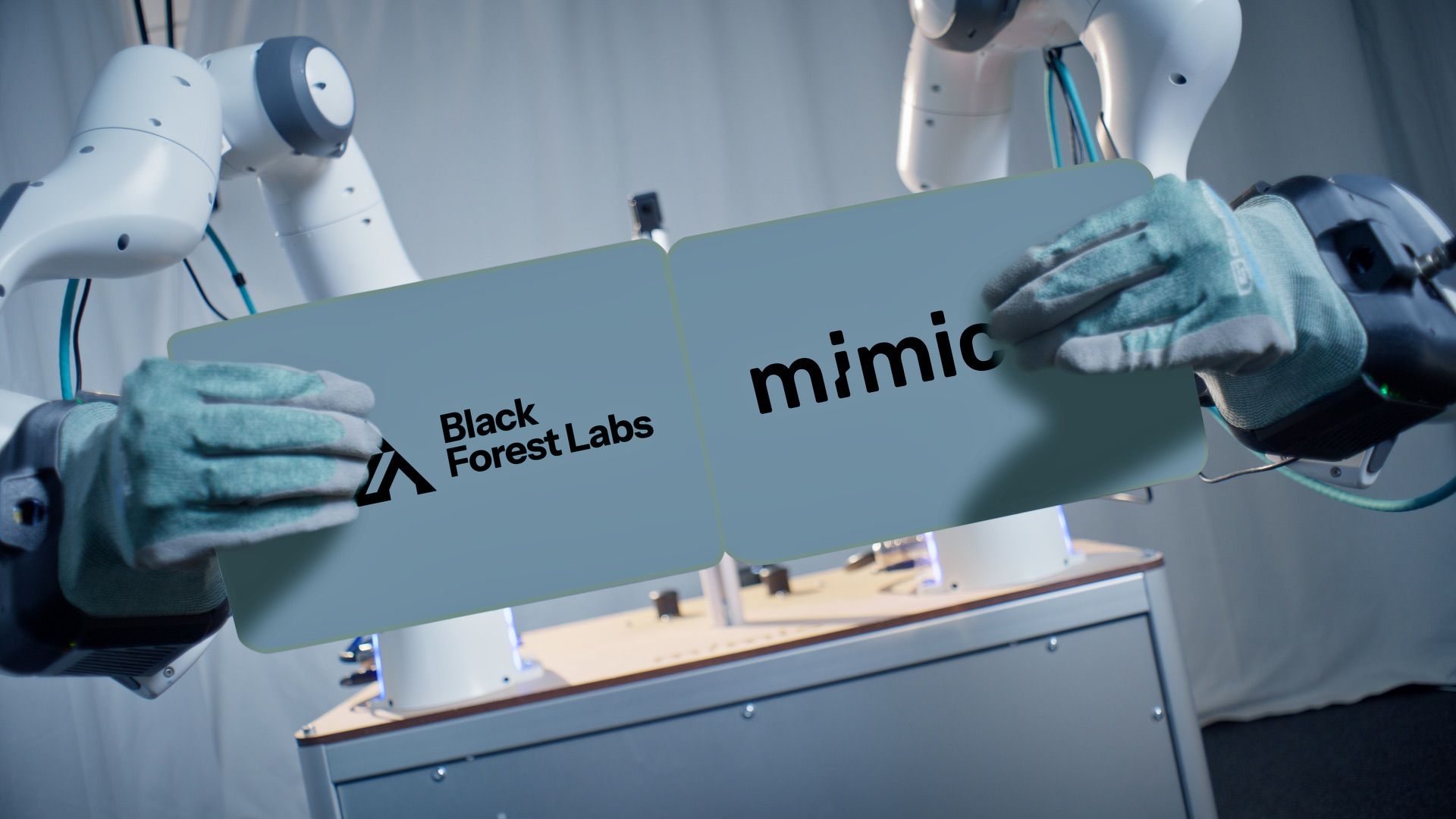 Robotic arms hold cards with Black Forest Labs and Mimic logos