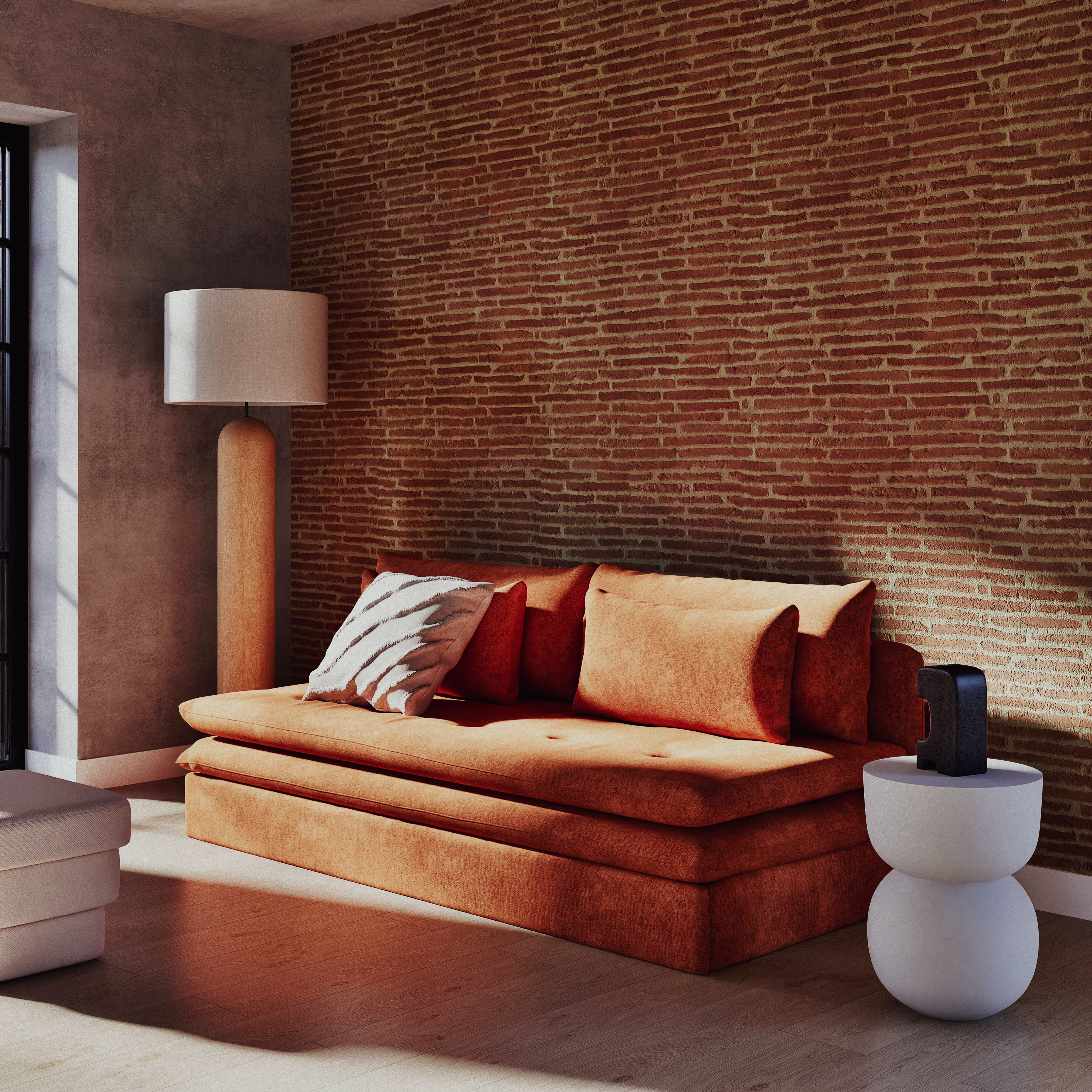 canape-rouge-brique-dans-un-salon-avec-mur-de-brique