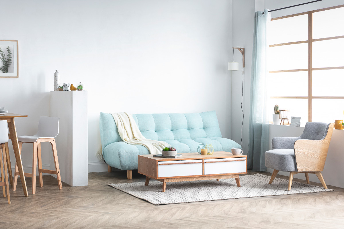 Canapé convertible scandinave en tissu menthe à l'eau et bois clair YUMI