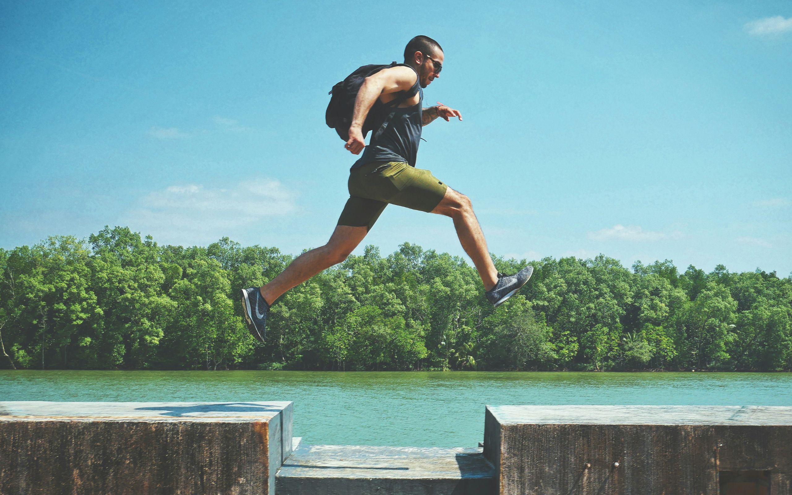 Man taking a decisive leap outdoors, beginning the Nirvu method