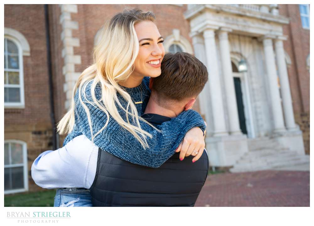 couple laughing in front of Old Main