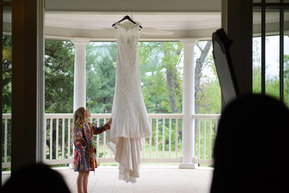 young girl looking at wedding dress