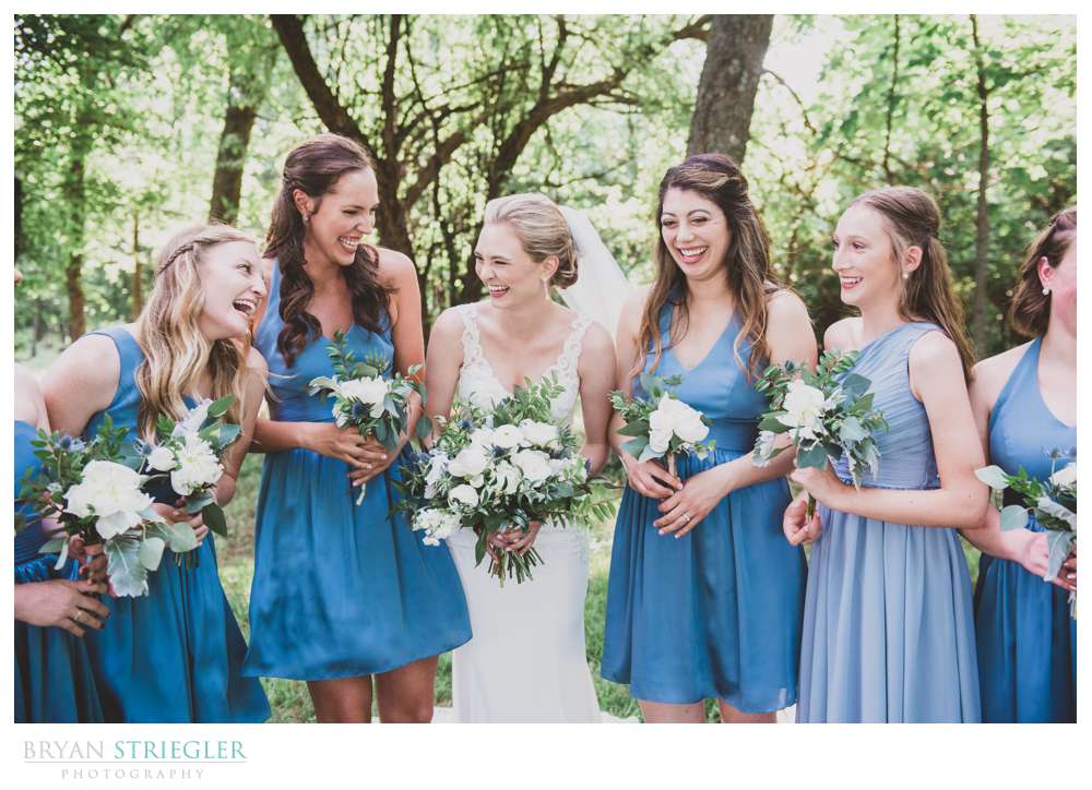 bride laughing with bridesmaids