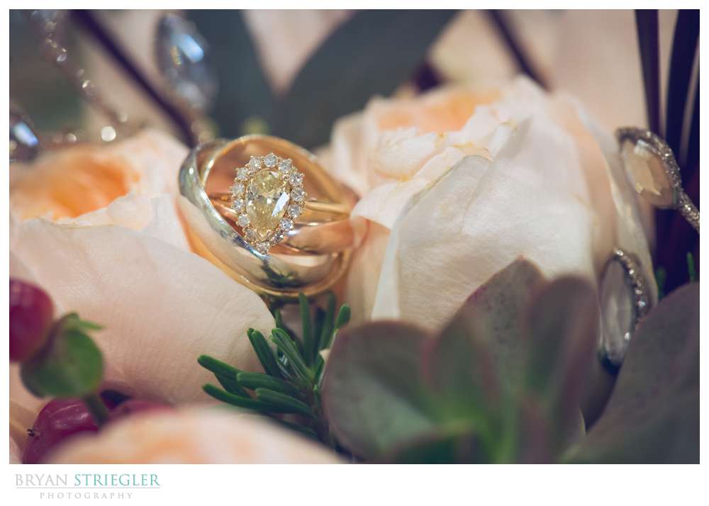 wedding and engagement ring in flowers