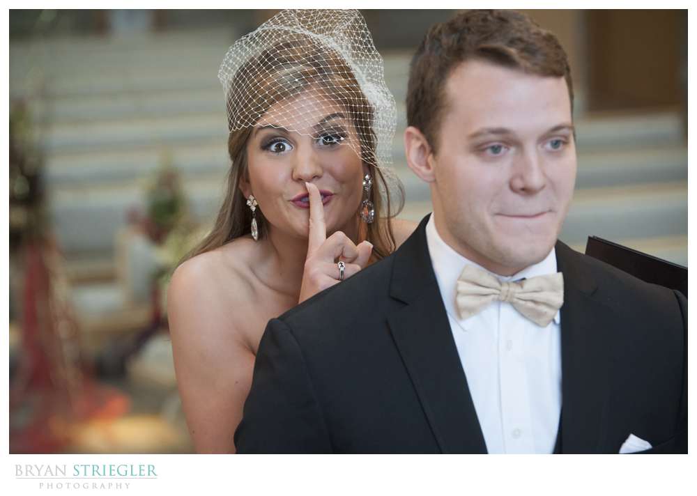 bride sneaking up on groom for first look