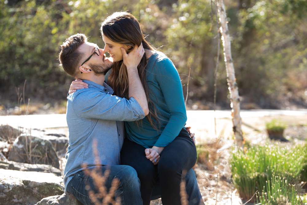 engagement photo with her sitting on his lap