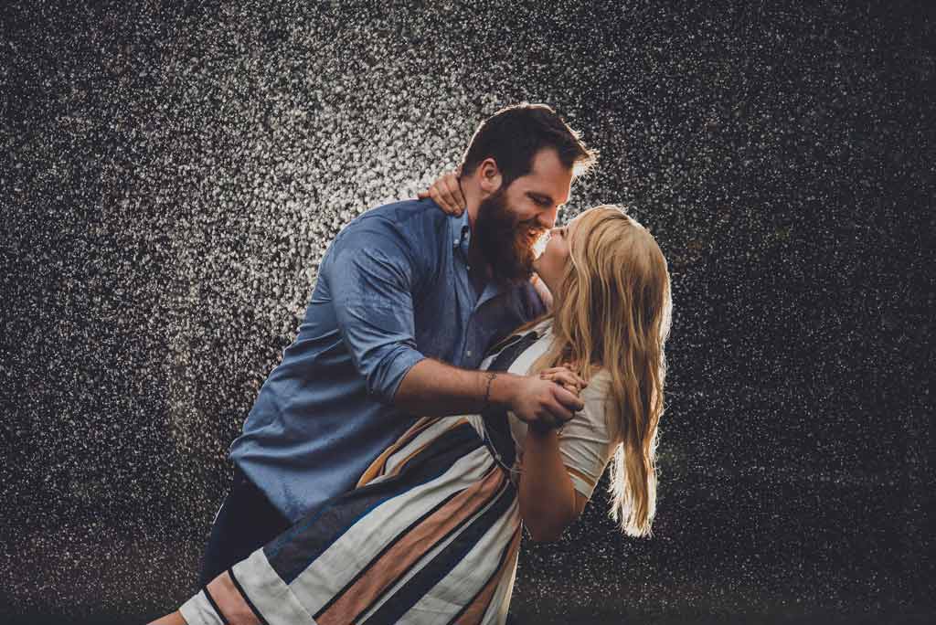 engagement photo in the rain