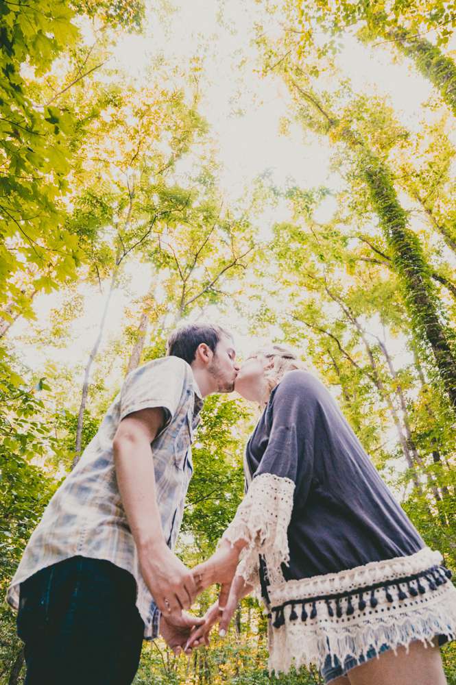 engagement photo with tall trees