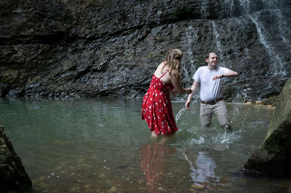 splashing in front of waterfall