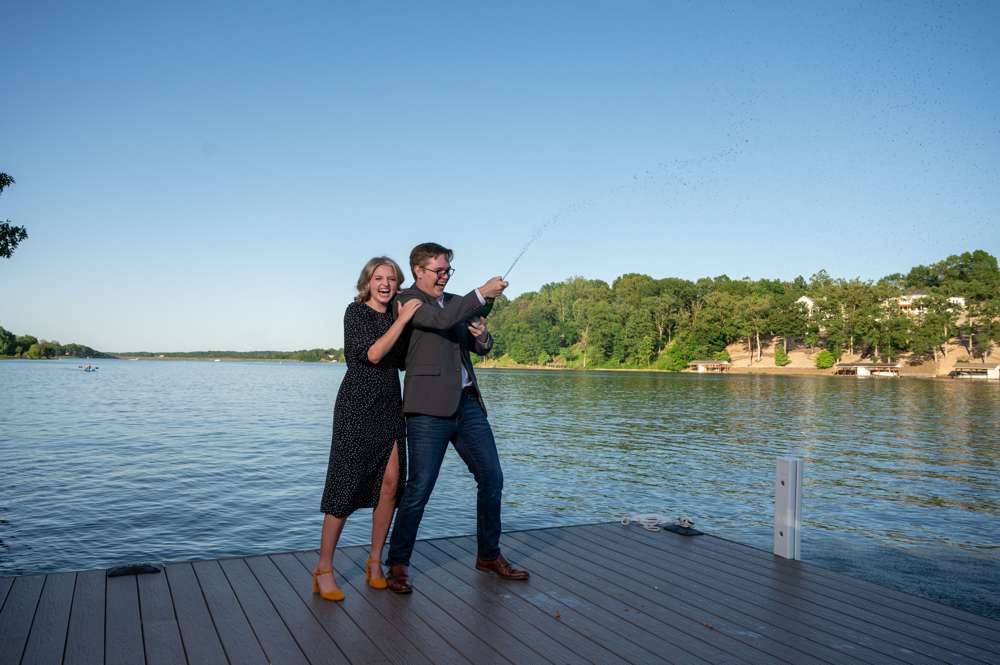 spraying champagne after wedding proposal