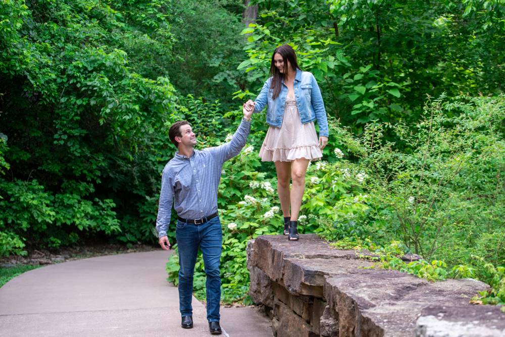 couple walking while guy holds her hand