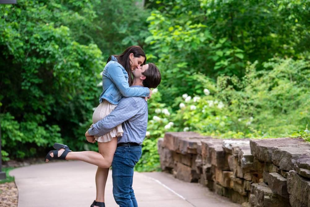 guy picking up girl and kissing