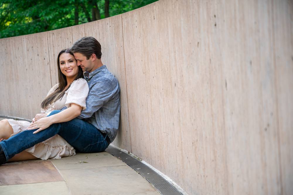 couple leaning against wall at Compton Gardens