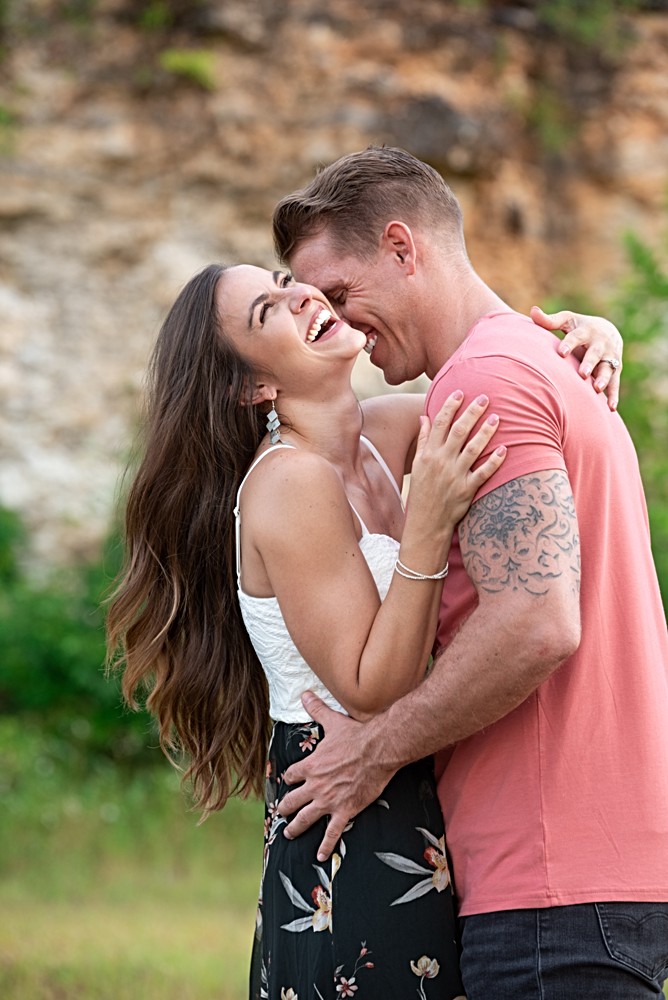 couple laughing during engagement photos
