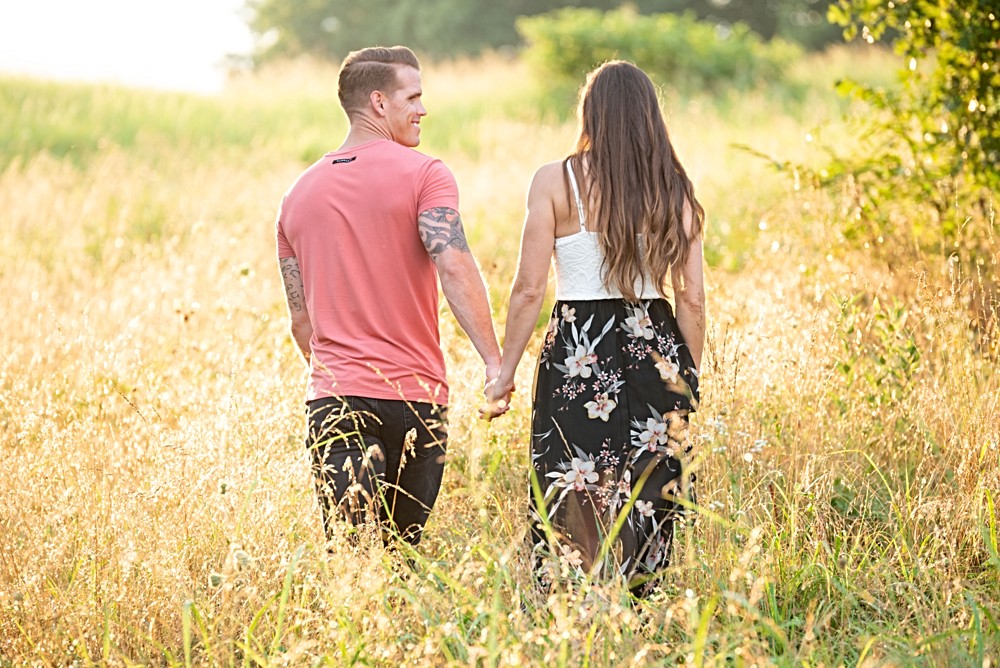 walking in field during sunset