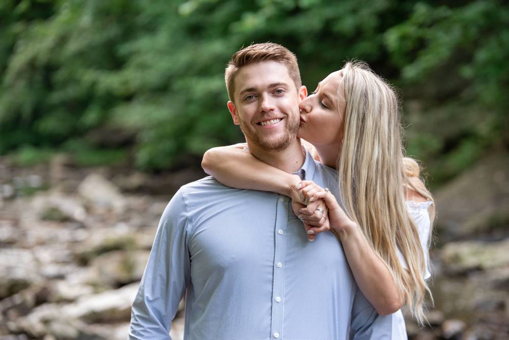 girl kissing guy during engagement session
