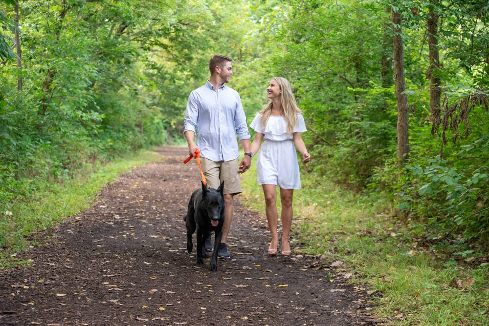couple walking dog
