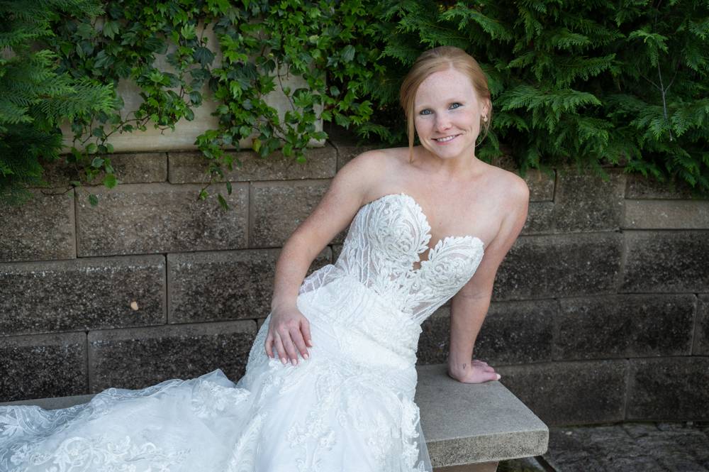 bride on stone bench
