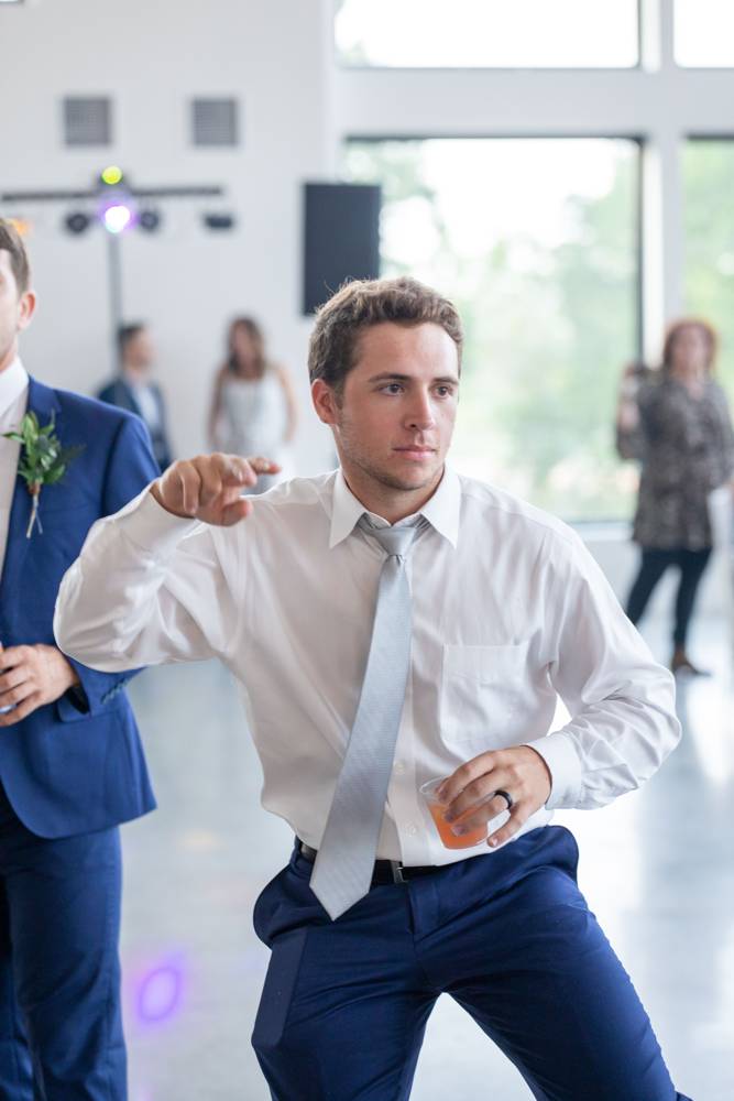guys dancing at reception at Osage House