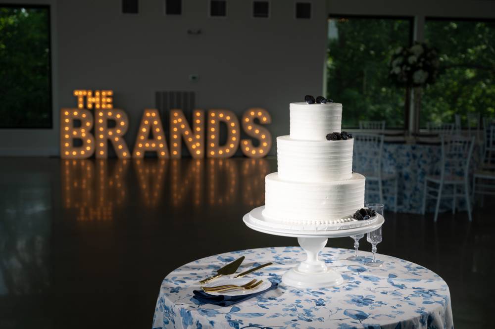 Wedding cake with custom wedding light sign