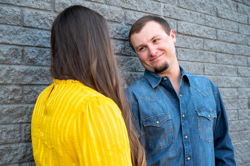 guy looking at girl during engagement session