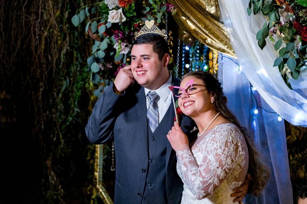 wedding couple in photo booth at Matt Lane Farm