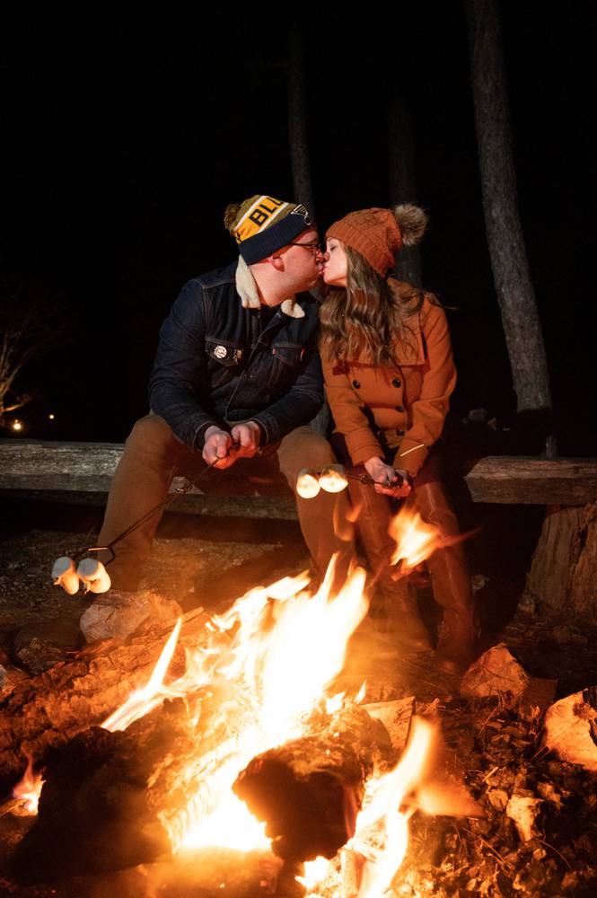 making s'mores in winter engagement shoot