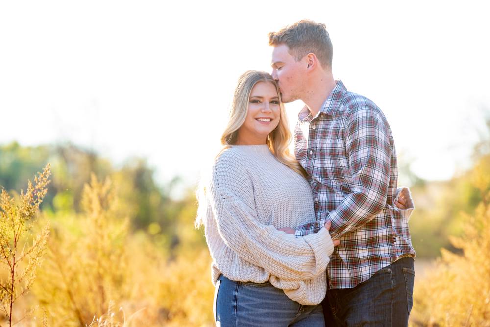 engagement photos in field with tall grass