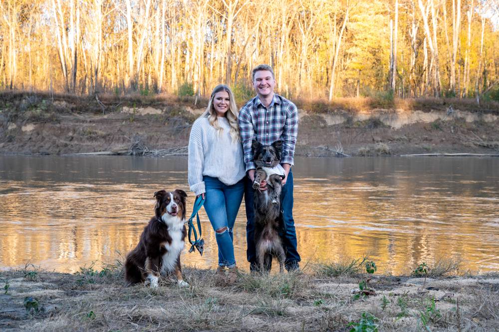 couple and dogs near the river at Castle Wood Park