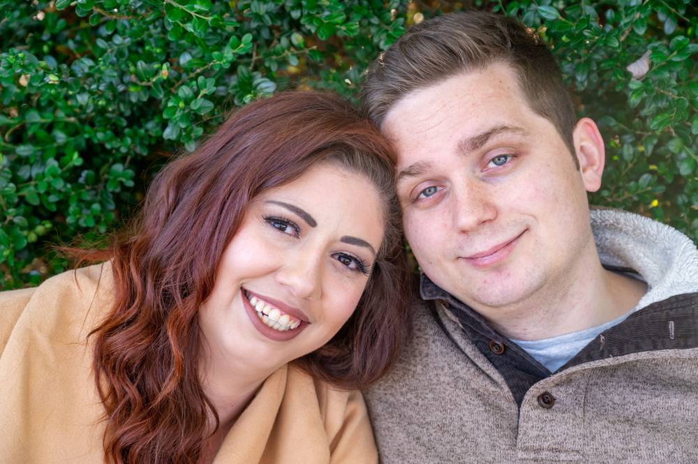 close up of couple sitting on bench