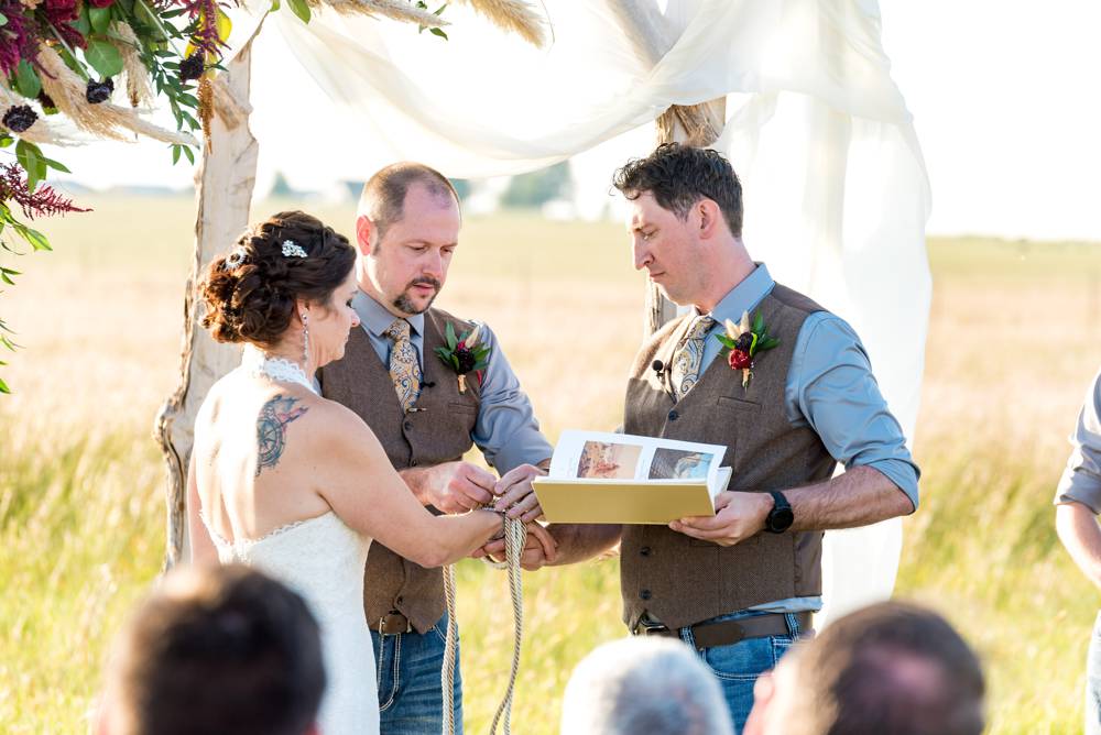 knot tying ceremony at outdoor wedding ceremony