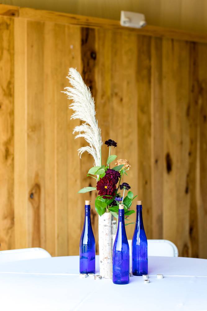 table settings with bottles and flowers