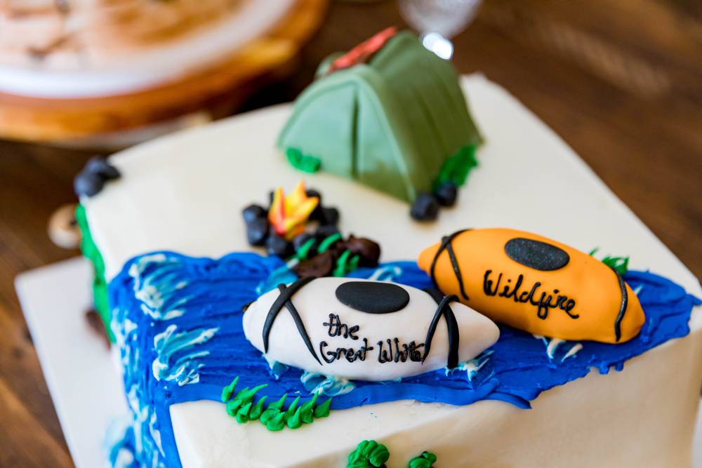 groom cake with tent and canoes