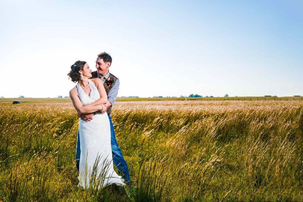 couple portraits in field at The Lodge at Rock Creek