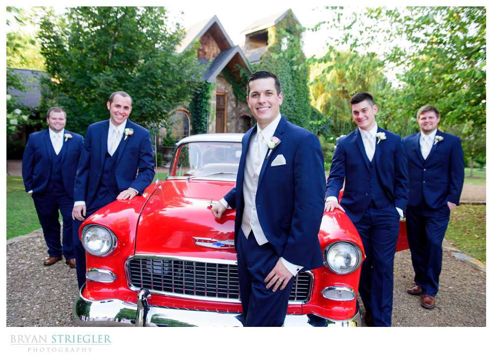 Groomsmen with classic car