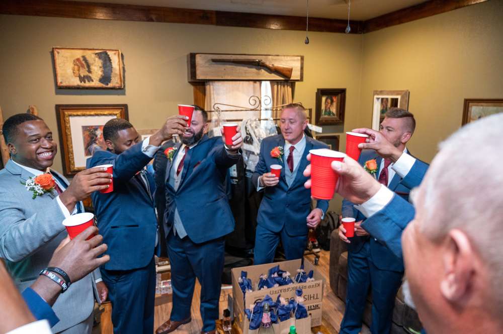 groomsmen taking shots