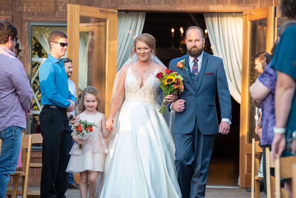 brother walking bride down the aisle