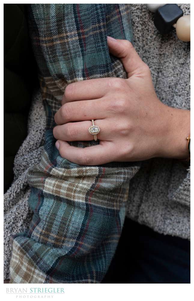 showing off engagement ring