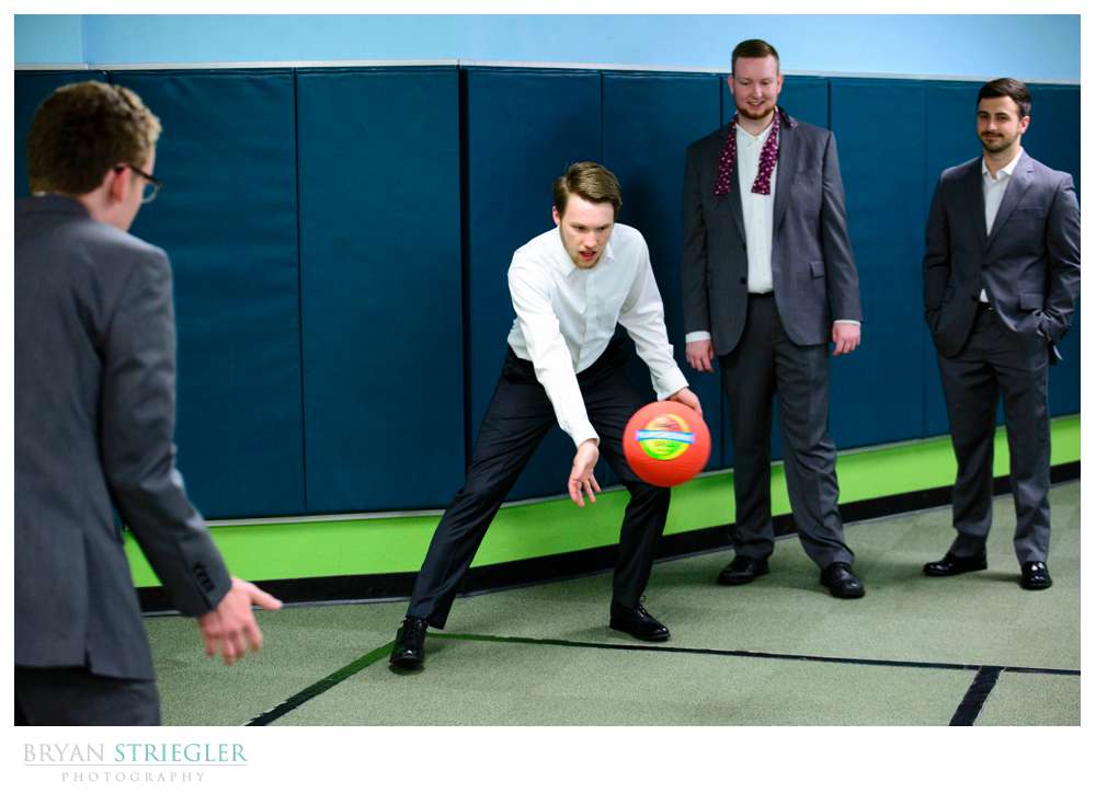 groomsmen playing dodgeball before wedding ceremony