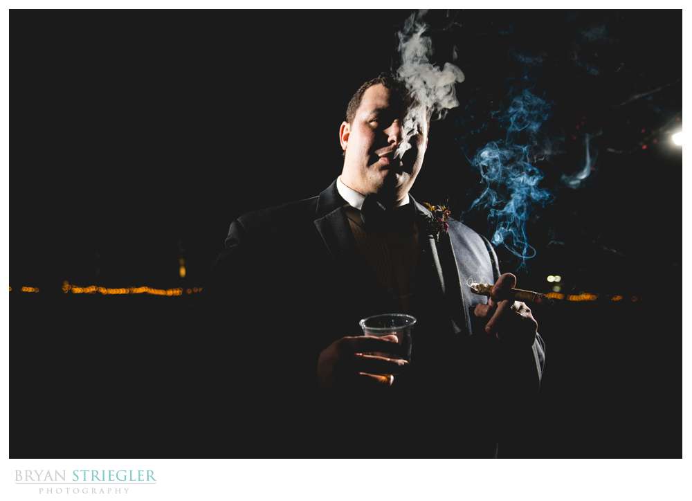 groom with cigar and whiskey