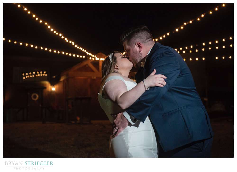 couple portrait with lights at the Barn at the Springs